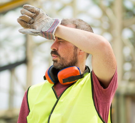Builder wiping head due to heat. Managing heat exposure at work